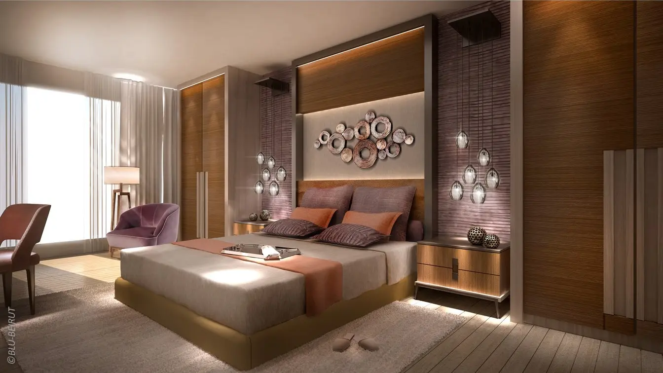 Stylish serviced suite living room in Saudi Arabia featuring gemstone-toned accents, curated art, and high-end interior design by Blu Beirut.