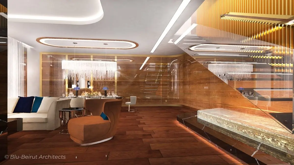 Luxurious duplex reception area with a sculptural staircase over a water element, polished walnut wood flooring, and indirect lighting—nautical-inspired design by Blu Beirut.