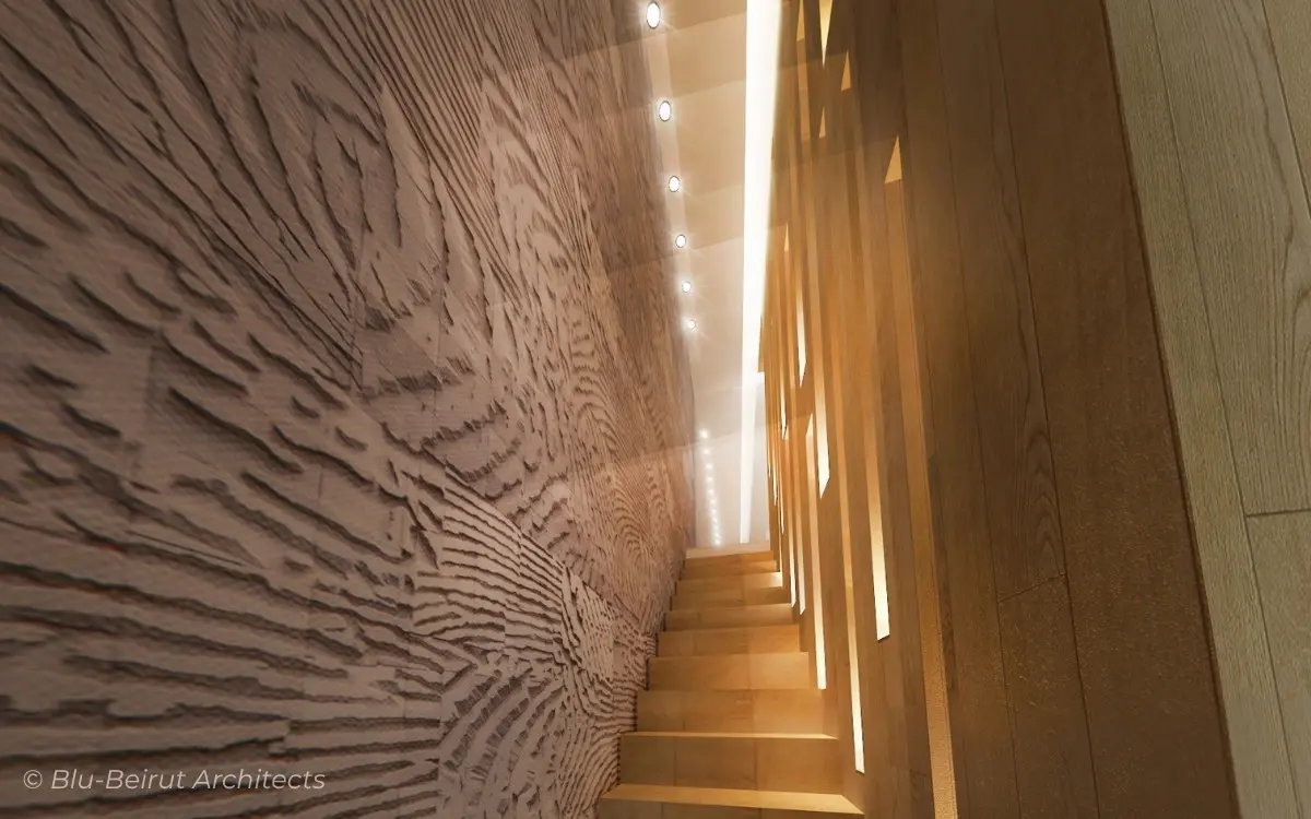 Architectural stairwell with sculptural textured wall and vertical lighting – part of Blu Beirut’s interior concept for a compact upscale restaurant in Jeddah.