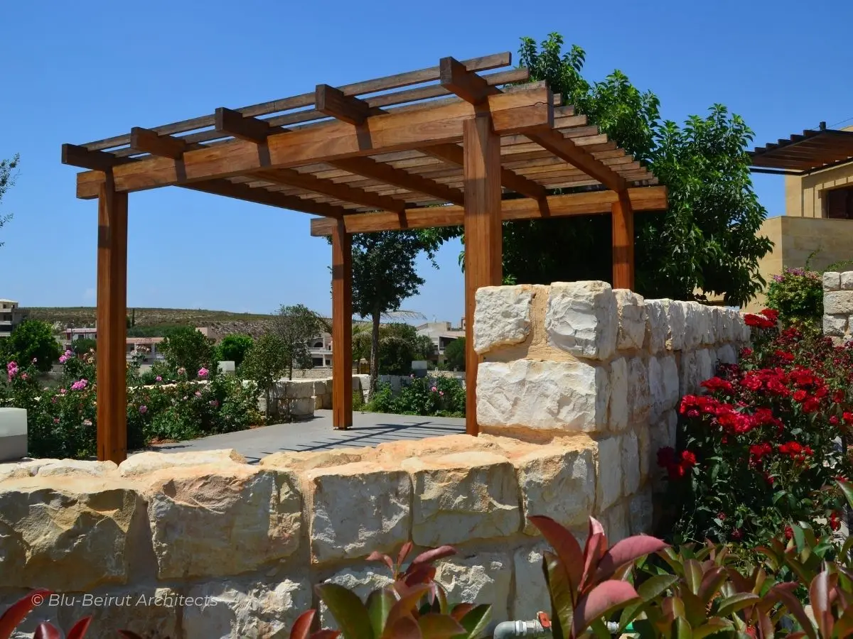 Outdoor dining area under wooden pergola