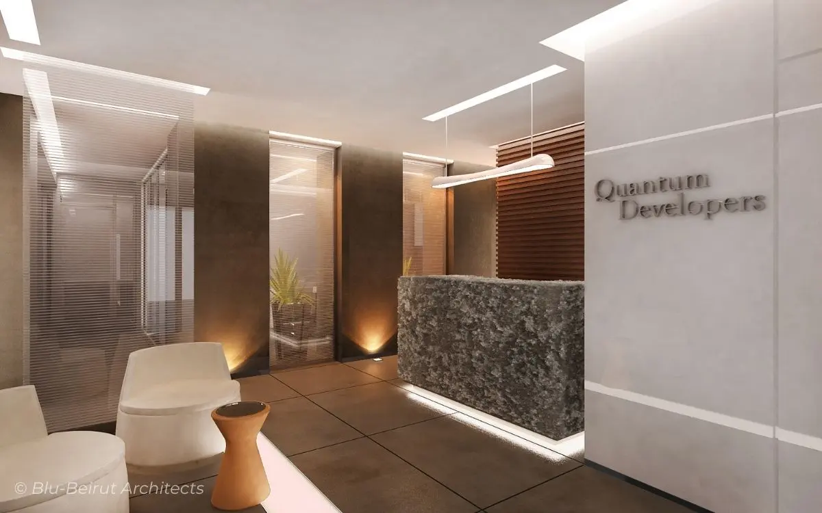 Contemporary office reception in Verdun featuring a sculptural rock-shaped desk cast from Liquid Metal, surrounded by teak wood cladding and polished concrete finishes.