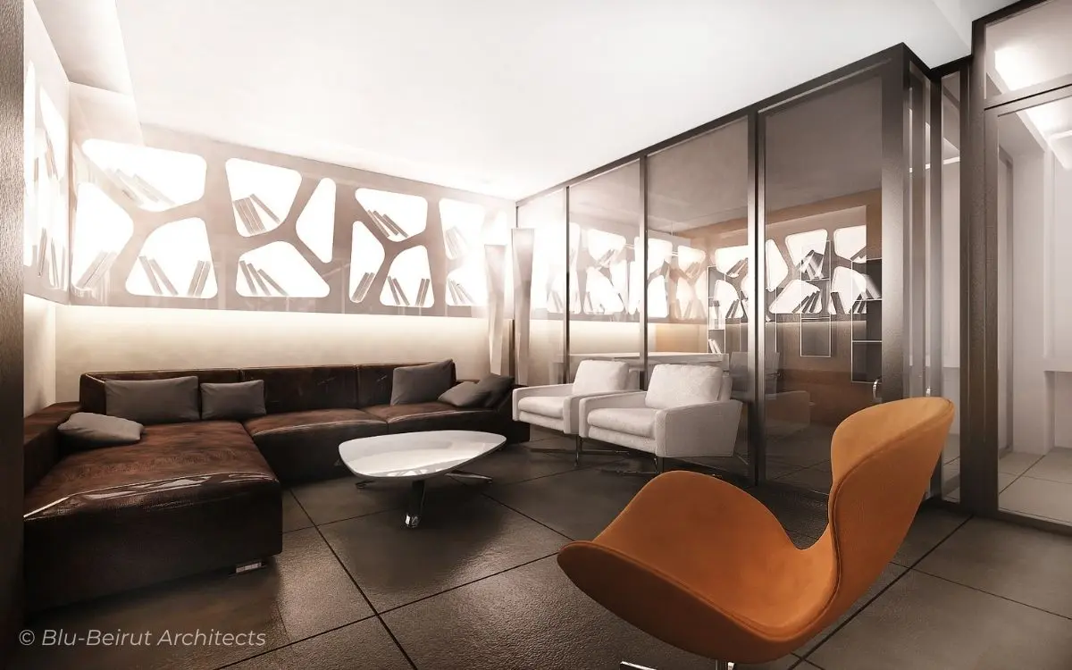 Lounge area with sculptural wall cut-outs, leather chairs, and concrete finishes—adding texture and brand identity to the workspace.