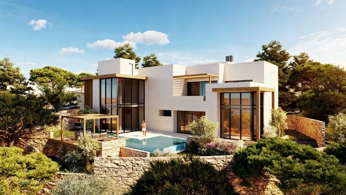 Villa on sloping site surrounded by trees and Mediterranean landscape