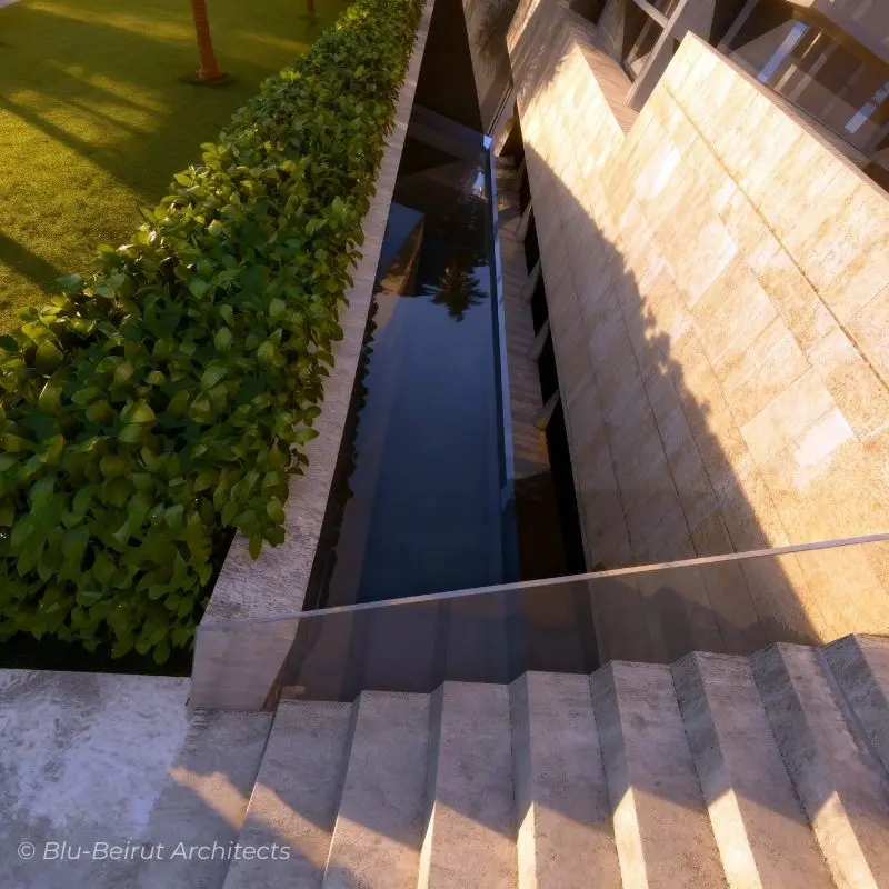 Sunken terrace and linear reflecting pool connecting the villa to the landscaped garden.