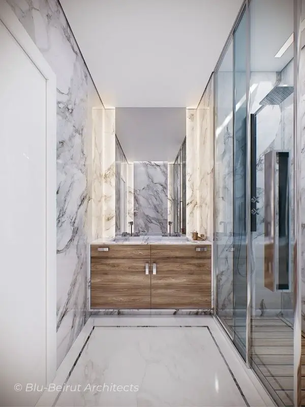 Bright and refined bathroom with full marble walls and flooring, enhancing the sense of purity and spaciousness by Blu-Beirut Architects