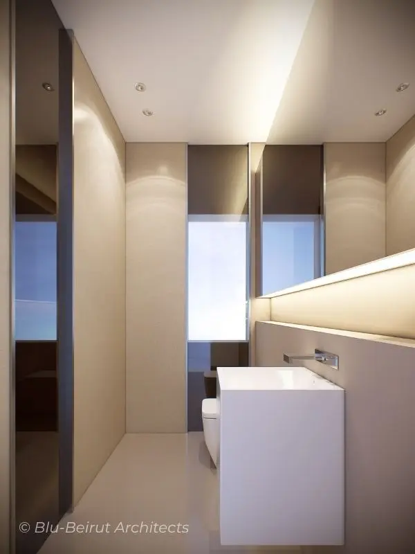 Luxurious powder room in Dubai apartment with clean geometry, backlit mirror, and tonal material layering by Blu Beirut.