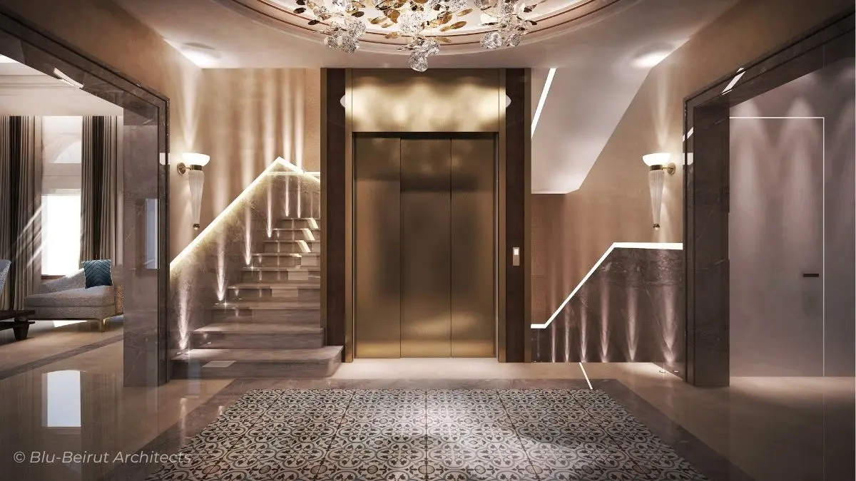 Grand staircase with marble finishes, chandelier, and refined symmetry connecting upper and lower villa levels.