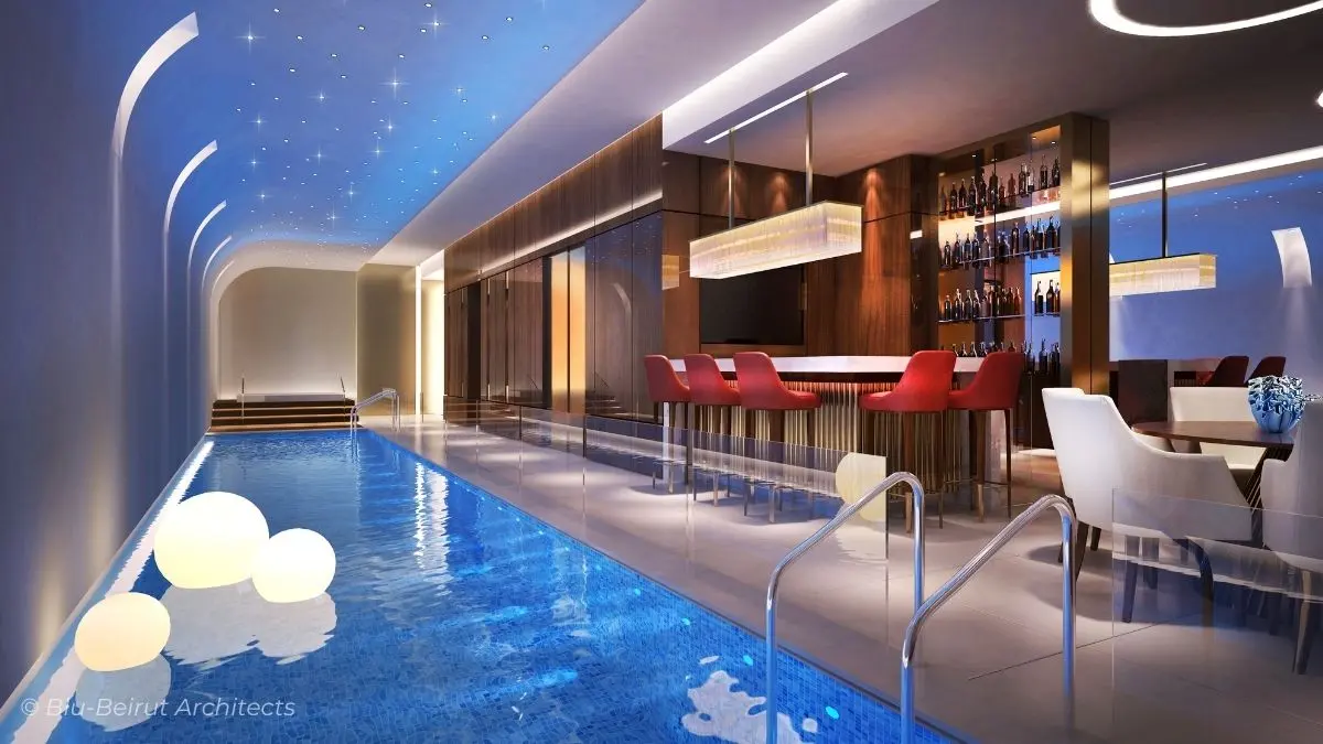 Contemporary indoor pool design with fiber optic lighting, and entertainment zone designed for relaxation by Blu-Beirut.