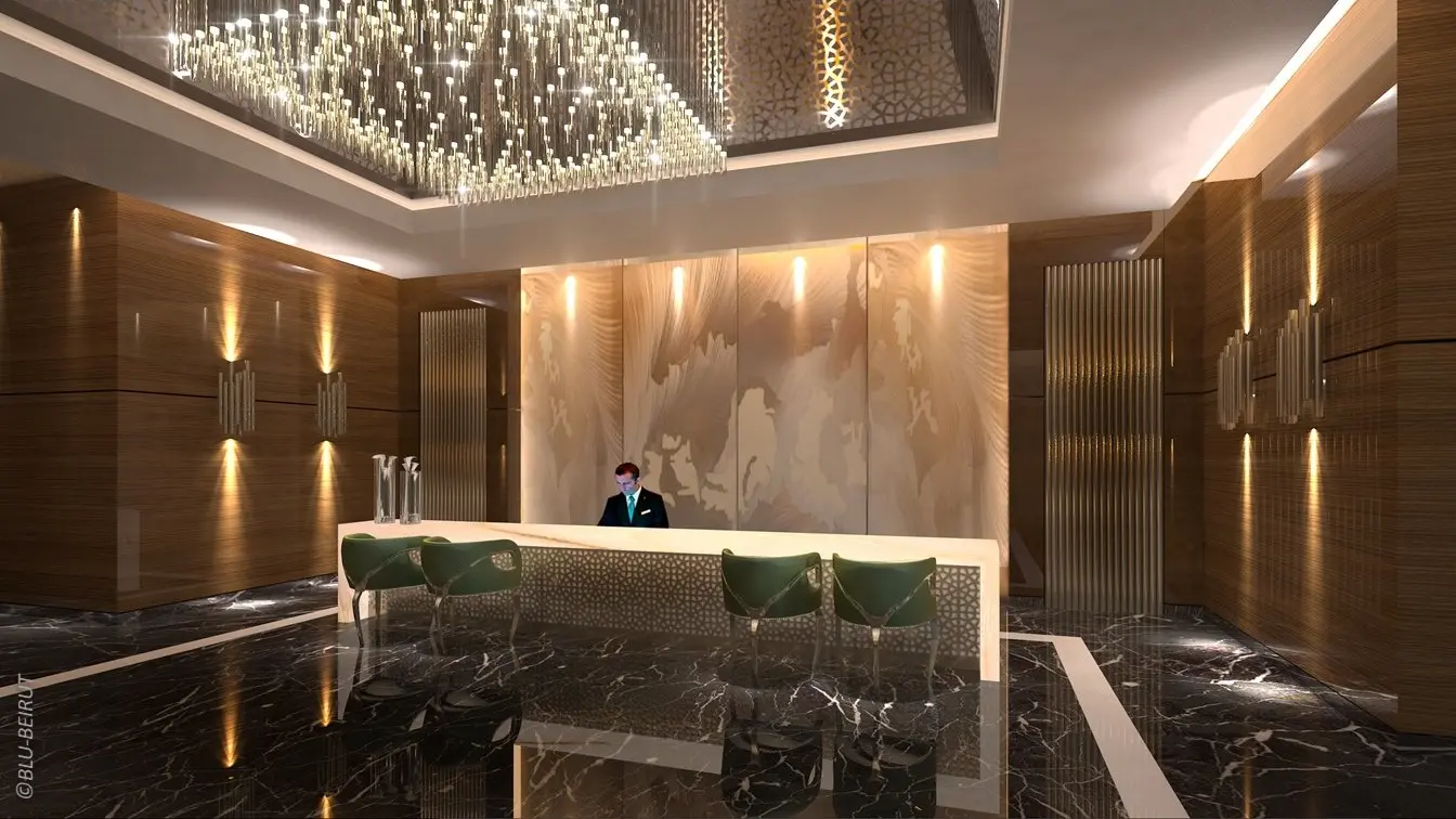 Reception area of Ascott Al Khobar Hotel with custom marble desk, crystal lighting fixtures, and contemporary hospitality design by Blu Beirut.